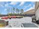 Expansive stone patio with built in seating, firepit, and outdoor grill at 2593 Pegasus Place, Myrtle Beach, SC 29577