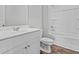 Bathroom featuring a white vanity, toilet and shower with tub on wood-look flooring at 272 Warner Crossing Way, Loris, SC 29569