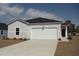 Charming single-story home featuring a two-car garage and neutral siding at 272 Warner Crossing Way, Loris, SC 29569