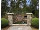 Community entrance with stone pillars and manicured landscaping with the Warner Crossing sign at 280 Warner Crossing Way, Loris, SC 29569