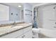 Bright bathroom featuring a shower and bathtub combination with granite countertop vanity at 2801 S Ocean Blvd. # 733, North Myrtle Beach, SC 29582