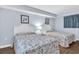 Bright bedroom featuring two cozy beds with decorative quilts and soothing blue walls at 2801 S Ocean Blvd. # 733, North Myrtle Beach, SC 29582