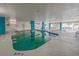 Bright indoor pool area with turquoise accents, shallow and deep ends and view of the ocean at 2801 S Ocean Blvd. # 733, North Myrtle Beach, SC 29582