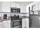 Well-equipped kitchen with stainless steel appliances and white cabinets at 2801 S Ocean Blvd. # 733, North Myrtle Beach, SC 29582
