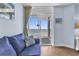 Living room with blue couch and balcony access with ocean views at 2801 S Ocean Blvd. # 733, North Myrtle Beach, SC 29582