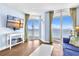 Cozy living room with an ocean view, a TV, and comfortable furniture at 2801 S Ocean Blvd. # 733, North Myrtle Beach, SC 29582