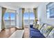 Inviting living room with ocean view, a blue couch, and a coffee table at 2801 S Ocean Blvd. # 733, North Myrtle Beach, SC 29582