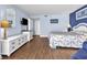 Well-lit bedroom featuring a full bed and dresser with television at 2801 S Ocean Blvd. # 733, North Myrtle Beach, SC 29582