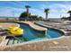 Inviting pool area with lazy river, lounge chairs, and palm trees, perfect for relaxation and fun at 2801 S Ocean Blvd. # 733, North Myrtle Beach, SC 29582