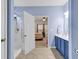 Bathroom featuring double sinks, shower, and doorway to bedroom at 300 Nuthatch Ln. # A, Murrells Inlet, SC 29576