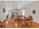 Open concept dining room, with hardwood floors, natural light, and views into the living room at 300 Nuthatch Ln. # A, Murrells Inlet, SC 29576