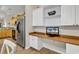 Kitchen featuring a built-in desk area, stainless steel refrigerator, and an open layout at 300 Nuthatch Ln. # A, Murrells Inlet, SC 29576