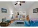 Cozy living room with wood floors, modern furnishings, and an open layout flowing into the kitchen at 300 Nuthatch Ln. # A, Murrells Inlet, SC 29576