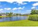 Scenic pond view with a fountain in a well-maintained community setting, highlighting serene waterfront living at 300 Nuthatch Ln. # A, Murrells Inlet, SC 29576