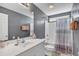 Stylish bathroom featuring a white vanity, mirror, and a coordinated shower curtain and towels at 3124 Ivy Lea Dr., Conway, SC 29526