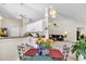 Open kitchen with white appliances and eat-in kitchen looks into living room with vaulted ceiling at 3124 Ivy Lea Dr., Conway, SC 29526