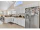 Kitchen area with stainless steel refrigerator, white cabinets and eat-in table at 3124 Ivy Lea Dr., Conway, SC 29526