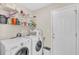 Neat laundry room with white washer, dryer, shelving, and a clean, organized look at 3124 Ivy Lea Dr., Conway, SC 29526