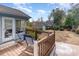 Back deck with wooden railing with partial view of the back yard at 317 14Th Ave. N, Surfside Beach, SC 29575