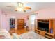 Bright bedroom with hardwood floors, a TV, and closet in the distance at 317 14Th Ave. N, Surfside Beach, SC 29575