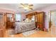 Spacious bedroom featuring wooden furniture and a patterned bed at 317 14Th Ave. N, Surfside Beach, SC 29575