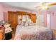 Bedroom featuring a closet with mirror panel doors and patterned bedding at 317 14Th Ave. N, Surfside Beach, SC 29575