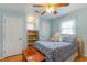 Comfortable bedroom with a ceiling fan and a wooden chest at the foot of the bed at 317 14Th Ave. N, Surfside Beach, SC 29575