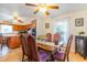 Elegant dining room with a large wooden table, stylish chairs, and a view into the kitchen at 317 14Th Ave. N, Surfside Beach, SC 29575