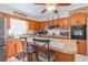 Well-lit kitchen with ample cabinet space, breakfast bar, and modern appliances at 317 14Th Ave. N, Surfside Beach, SC 29575