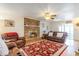 Bright living room featuring a brick fireplace, comfortable seating, and natural light at 317 14Th Ave. N, Surfside Beach, SC 29575