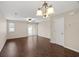 Spacious living room with beautiful hardwood floors, neutral walls, ceiling fan, and a sliding door to the patio at 3524 Crepe Myrtle Ct. # 3524, Myrtle Beach, SC 29577