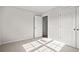 Bedroom featuring neutral paint, plush carpet, and a white door at 375 West Dogwood Rd., Loris, SC 29569