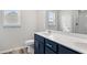 Well-lit bathroom featuring a modern vanity with dual sinks and a large mirror at 379 West Dogwood Rd., Loris, SC 29569