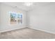 Bright bedroom featuring a window view and neutral carpet at 383 West Dogwood Rd., Loris, SC 29569