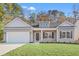 Charming single-story home featuring a gray exterior, attached garage, and well-manicured lawn at 383 West Dogwood Rd., Loris, SC 29569