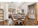 Cozy dining area with a wood table, seating for four, and sliding glass door leading to the outside at 4027 Taranto Loop # 3203-C, Myrtle Beach, SC 29579