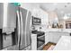 Close-up of a modern kitchen featuring stainless steel appliances and white cabinets at 4027 Taranto Loop # 3203-C, Myrtle Beach, SC 29579