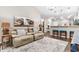 Comfortable living room with a leather recliner, decorative rug, and bar counter looking into the kitchen at 4027 Taranto Loop # 3203-C, Myrtle Beach, SC 29579