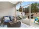 Relaxing screened-in porch featuring seating, a lantern, and an outdoor view at 4027 Taranto Loop # 3203-C, Myrtle Beach, SC 29579