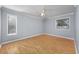 Well-lit bedroom with two windows, light wood floors, and neutral-colored walls at 407 76Th Ave. N # C, Myrtle Beach, SC 29572