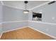 Dining room area featuring modern lighting, chair railing and view into the kitchen at 407 76Th Ave. N # C, Myrtle Beach, SC 29572