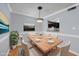 Dining room area featuring modern lighting and view into the kitchen with seating for six at 407 76Th Ave. N # C, Myrtle Beach, SC 29572