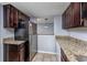 Kitchen with granite countertops and stainless steel refrigerator at 407 76Th Ave. N # C, Myrtle Beach, SC 29572