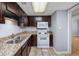 Kitchen featuring tile floors and stainless steel sink at 407 76Th Ave. N # C, Myrtle Beach, SC 29572