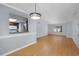 Bright living room with hardwood floors and view into the kitchen featuring stainless steel appliances at 407 76Th Ave. N # C, Myrtle Beach, SC 29572