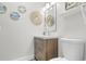 Bathroom features a vanity, artistic mirror and accents, and a toilet at 4655 Wild Iris Dr. # 101, Myrtle Beach, SC 29577