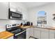 Bright kitchen with stainless steel appliances, butcher block counters, white cabinets, and light wood-look floors at 4655 Wild Iris Dr. # 101, Myrtle Beach, SC 29577