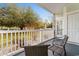 Relaxing patio featuring seating with views of the landscaped yard and surrounding greenery at 4655 Wild Iris Dr. # 101, Myrtle Beach, SC 29577