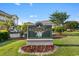 Elegant Magnolia Place community sign amidst manicured landscaping and seasonal flowers at 4655 Wild Iris Dr. # 101, Myrtle Beach, SC 29577