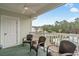 Balcony with patio seating overlooking the pool and trees at 4870 Dahlia Ct. # 304, Myrtle Beach, SC 29577